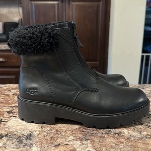 NWOB Comfy UGG black leather boots. Front zip with sheepskin around top. Size 10
